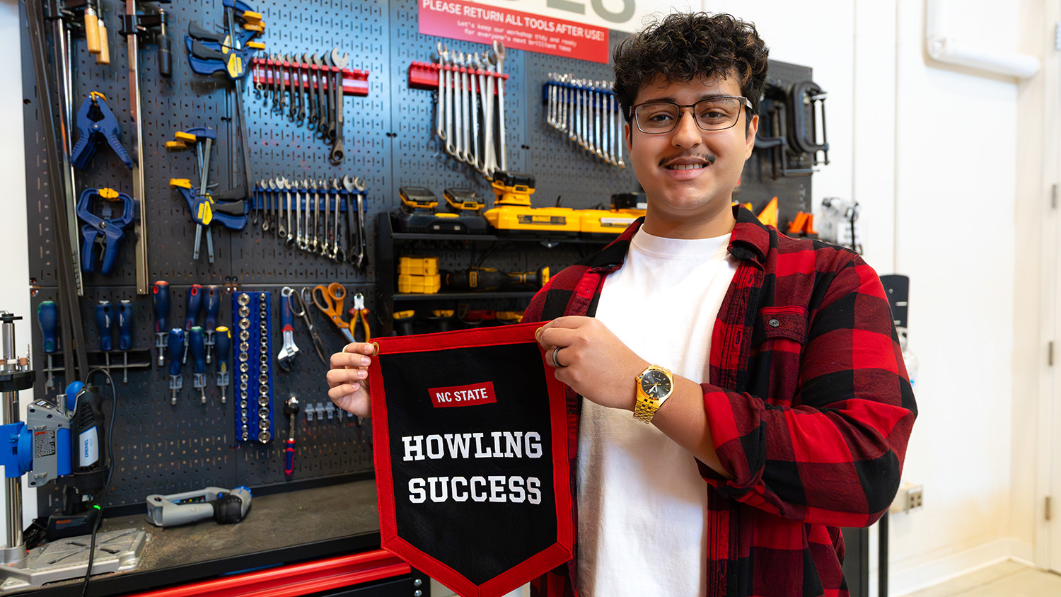 A photo of Daniel Briceno in a workshop